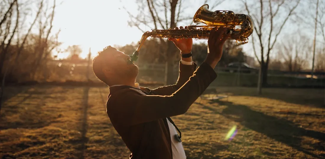 young-musician-playing-the-saxophone-at-sunset-2022-03-04-06-02-42-utc